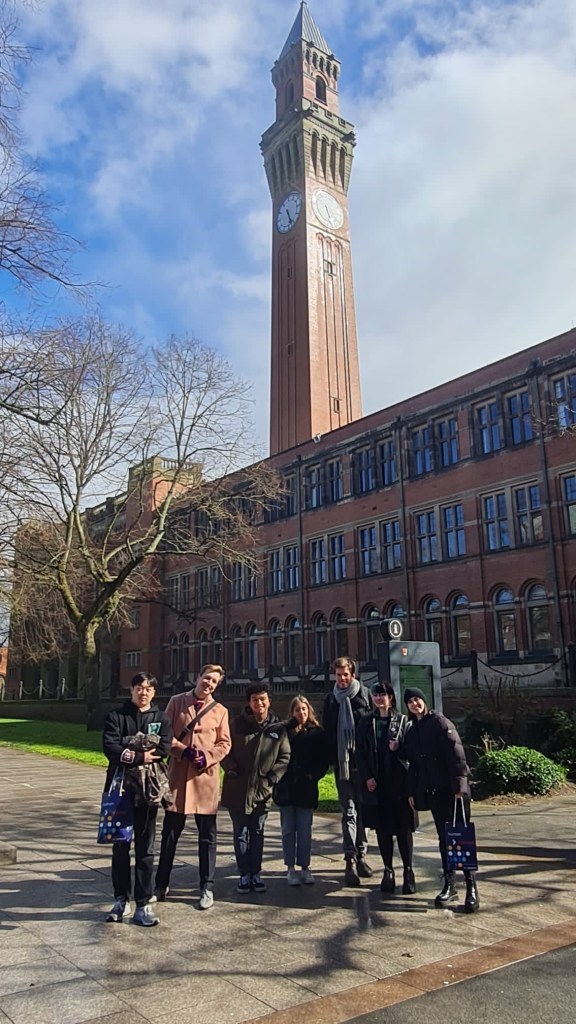 Group photo in front of Old Joe clock tower at University of Birmingham.